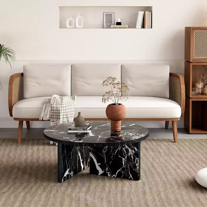 Table basse ronde noire en MDF polyvalente pour différents styles d'intérieur, alliant minimalisme moderne et charme nordique