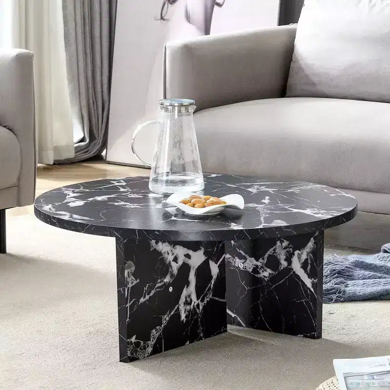 Table basse ronde noire en MDF polyvalente pour différents styles d'intérieur, alliant minimalisme moderne et charme nordique
