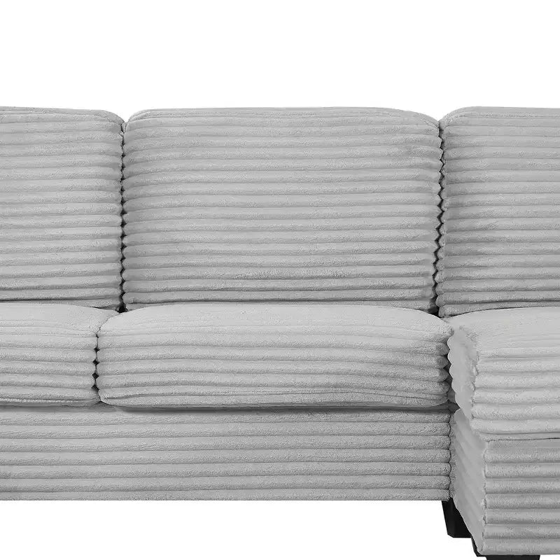 Canapé d'angle en velours côtelé Whisen avec pouf mobile et poches de rangement latérales